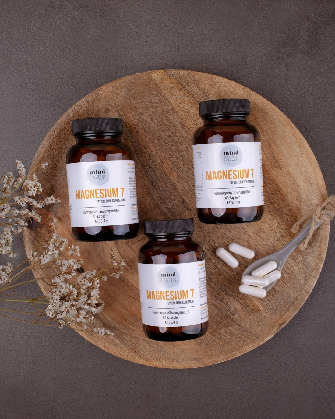 magnesium supplement bottles on wooden plate minerals recovery sleep